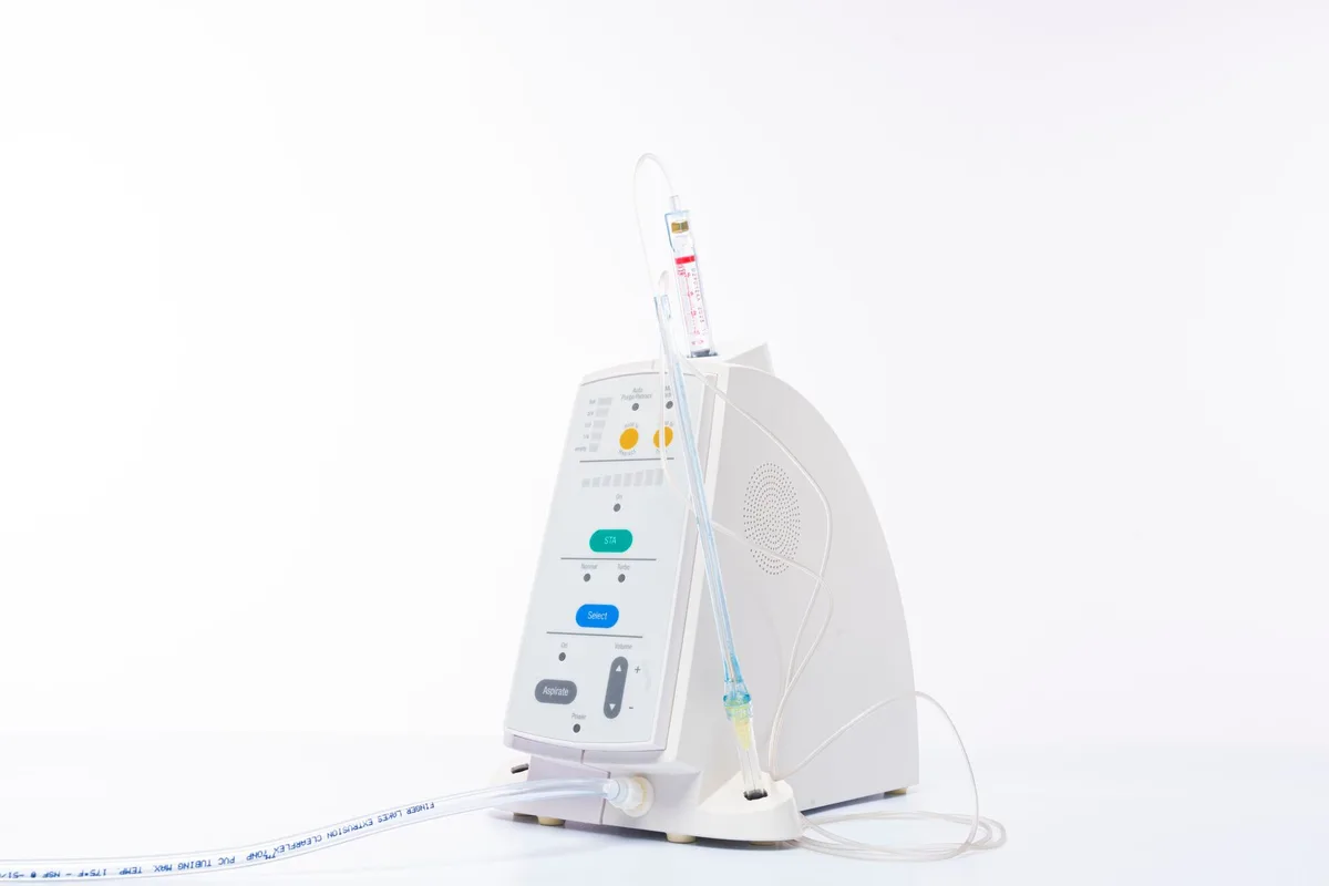 An implanted intrathecal pump and catheter positioned along the lower spine.