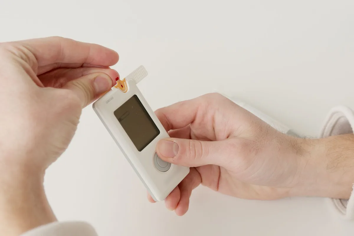 A clinician performing a monofilament sensation test on a patient's foot.