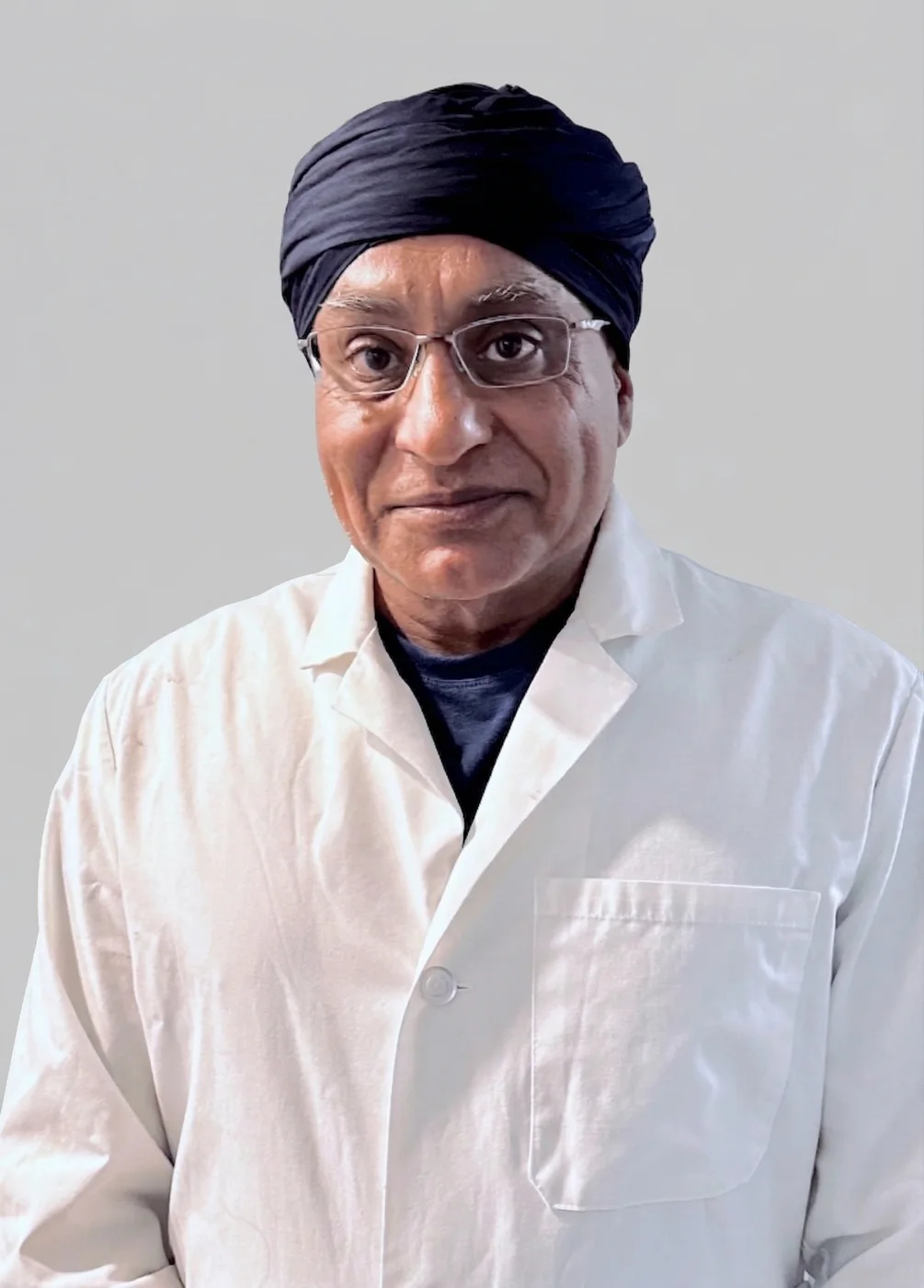 Dr. Gurpreet Singh Padda, MD, MBA, MHP, medical director of painstl.com, photographed in a white coat against a plain background.